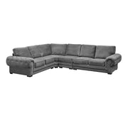 A dark grey full back corner sofa with six seats and chrome feet, displayed in a room setting.