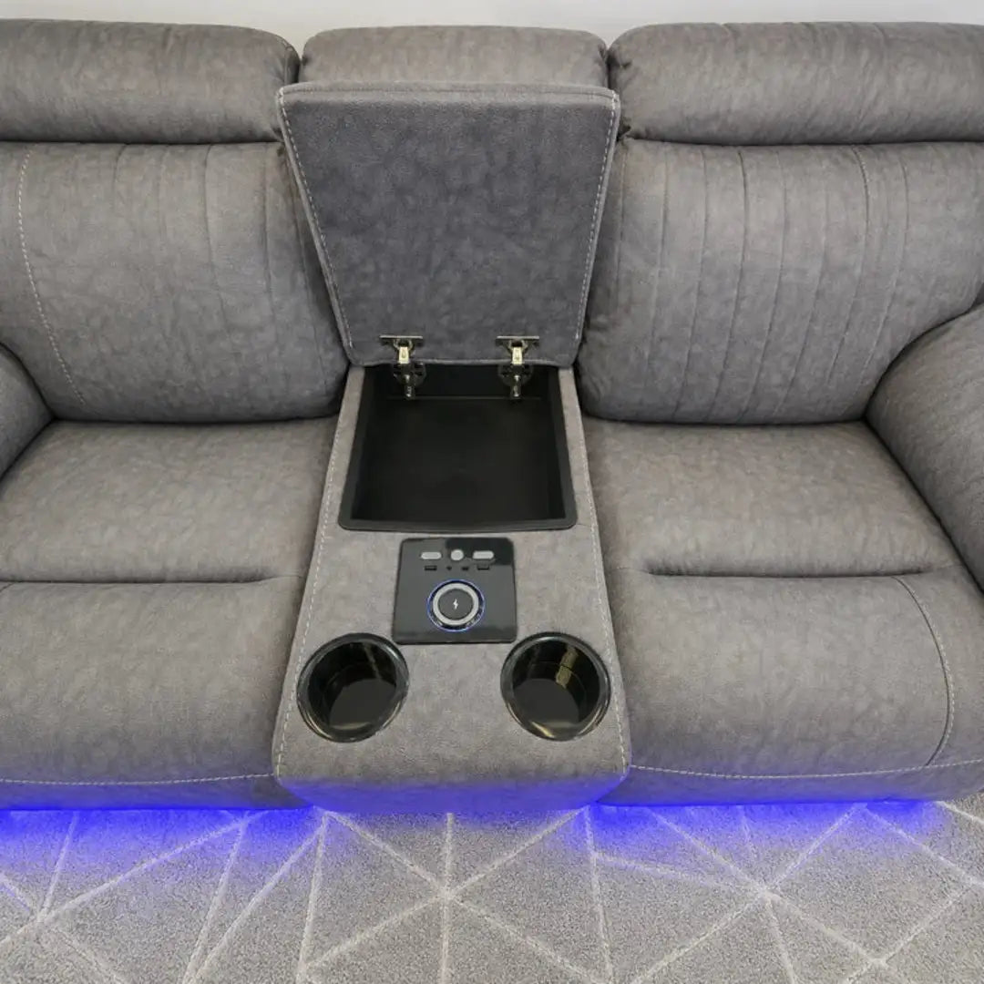 Grey fabric corner sofa with blue LED lighting for a home cinema look