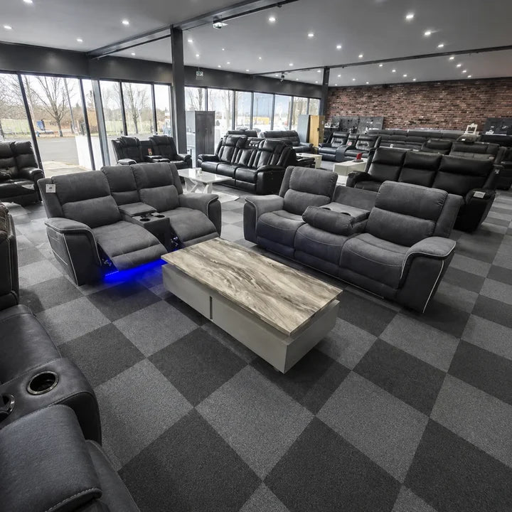 Grey recliner sofa set with blue LED strip lighting along the base